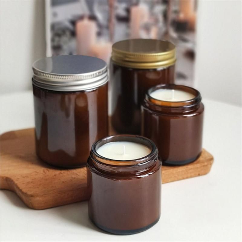 a Glass Can for Holding Candles. a Brown Glass Candlestick with a Lid