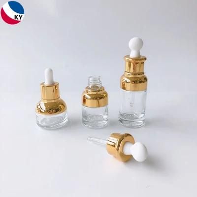 Luxury 15ml 30ml 50ml Round Gold Shoulder High Quality Clear Glass Bottle Dropper Clear Glass Bottles Rubber Oblate Dropper