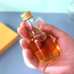 Customized Small Glassware Glass Wine Bottles with Handle 100ml Flint Glass Bottle